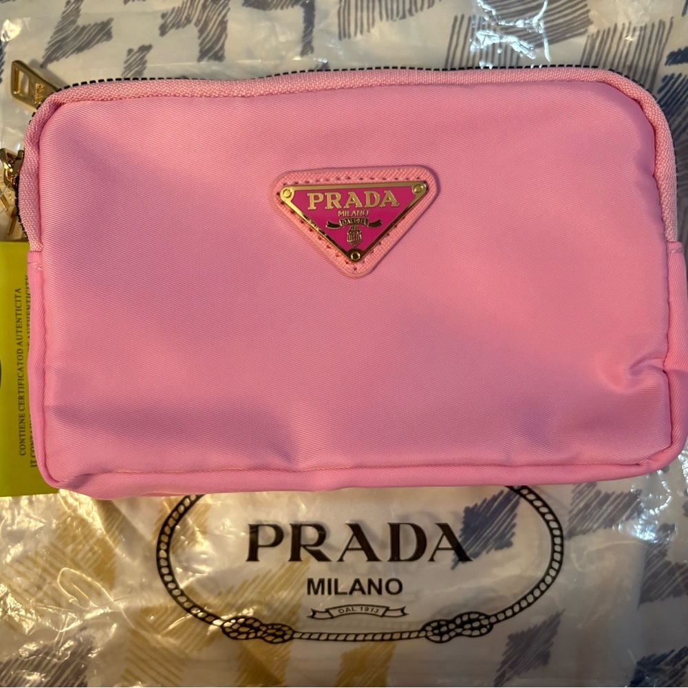 Pink Nylon Cross Body
Three separate zippered compartments.